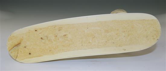 A Japanese sectional walrus ivory okimono of a Bactrian camel and a man, early 20th century, length 26cm